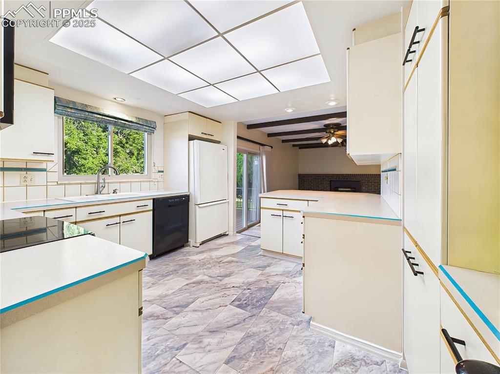 Image 12 of 49: Kitchen & Family Room Overview – Spacious eat-in kitchen with newer luxury