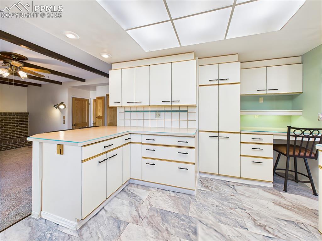 Image 14 of 49: Kitchen Storage & Built-In Desk – Smart kitchen design includes built-in de