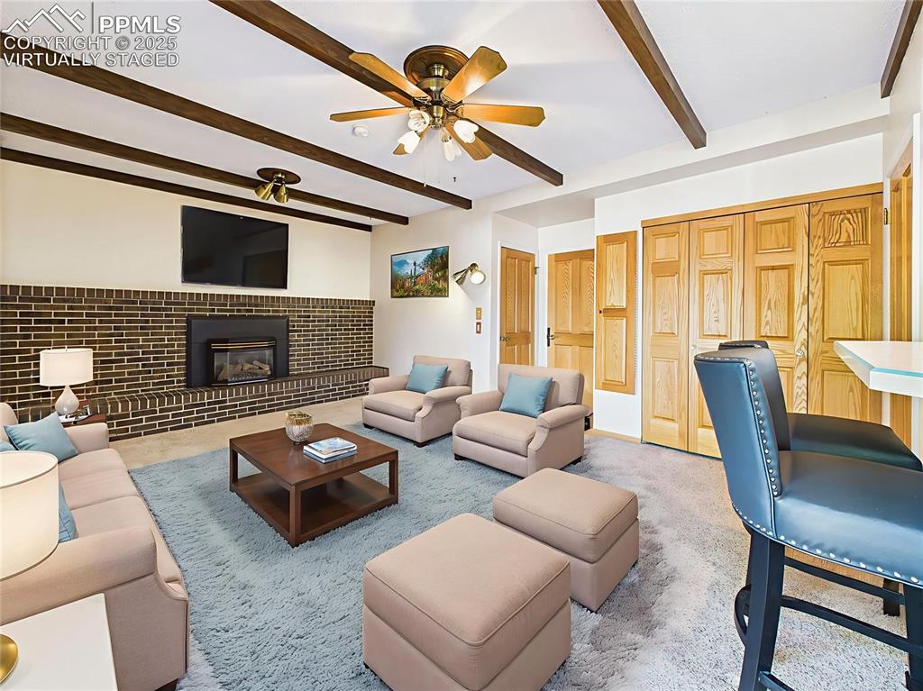 Image 16 of 49: Virtually Staged Family Room to showcase layout flexibility, this warm gath