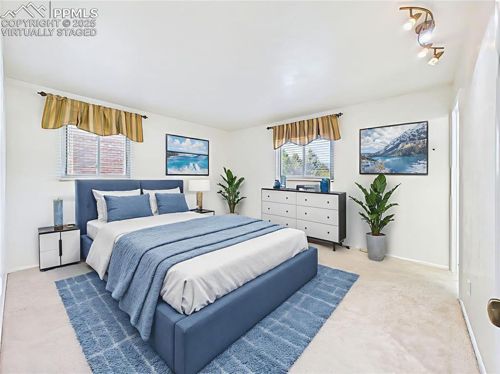 Image 22 of 49: Virtually Staged Primary Bedroom highlight its layout, offering dual windo