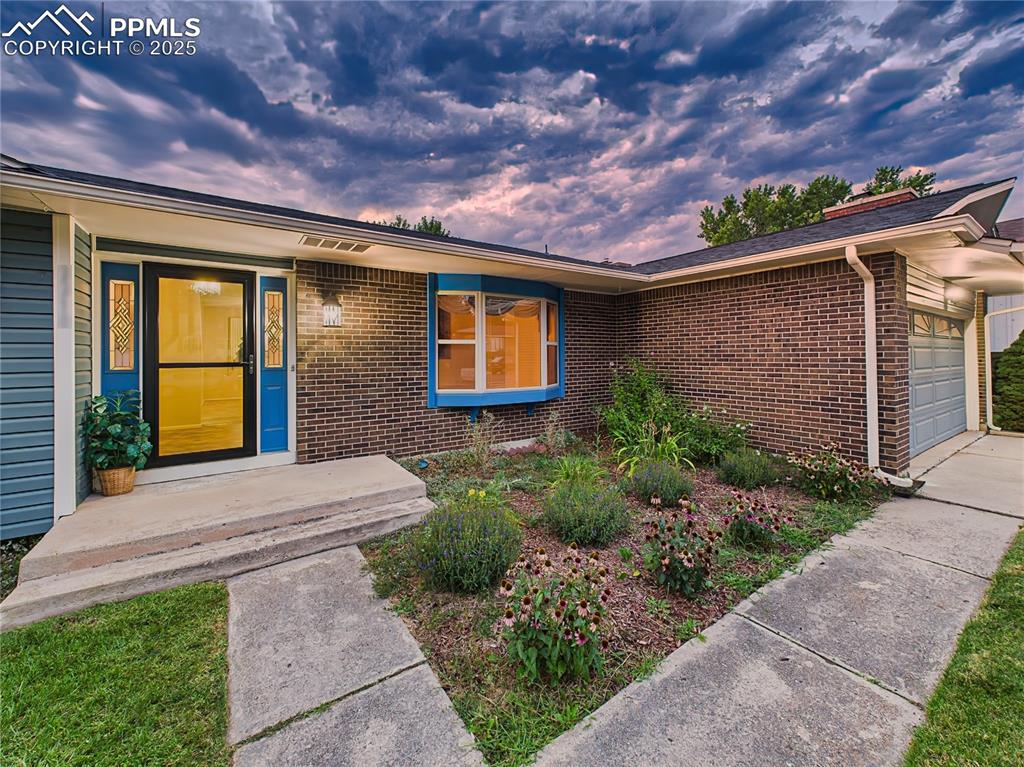 Image 3 of 49: Front Entry – Welcoming entrance showcases a custom beveled glass front doo
