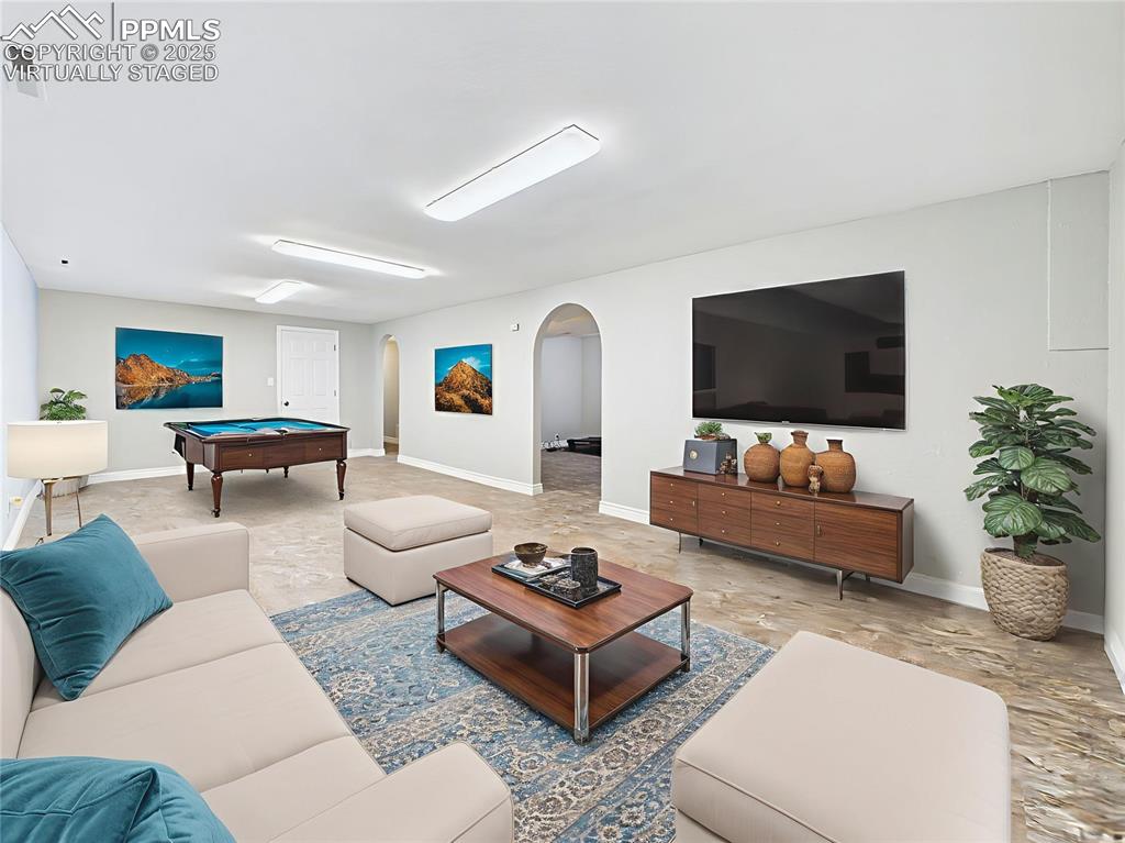 Image 34 of 49: Virtually Staged Basement Entertaining Area alternate view of this large ba