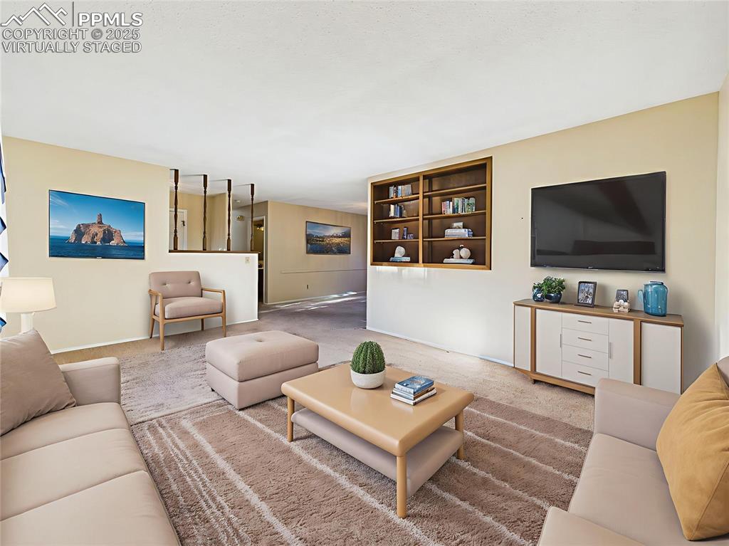 Image 6 of 49: Virtually Staged Living Room to Formal Dining View – The virtually staged l