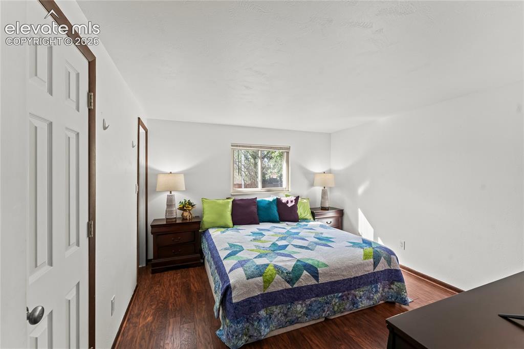 Image 26 of 45: Dedicated laundry area featuring overhead wood cabinetry and a ceiling-moun