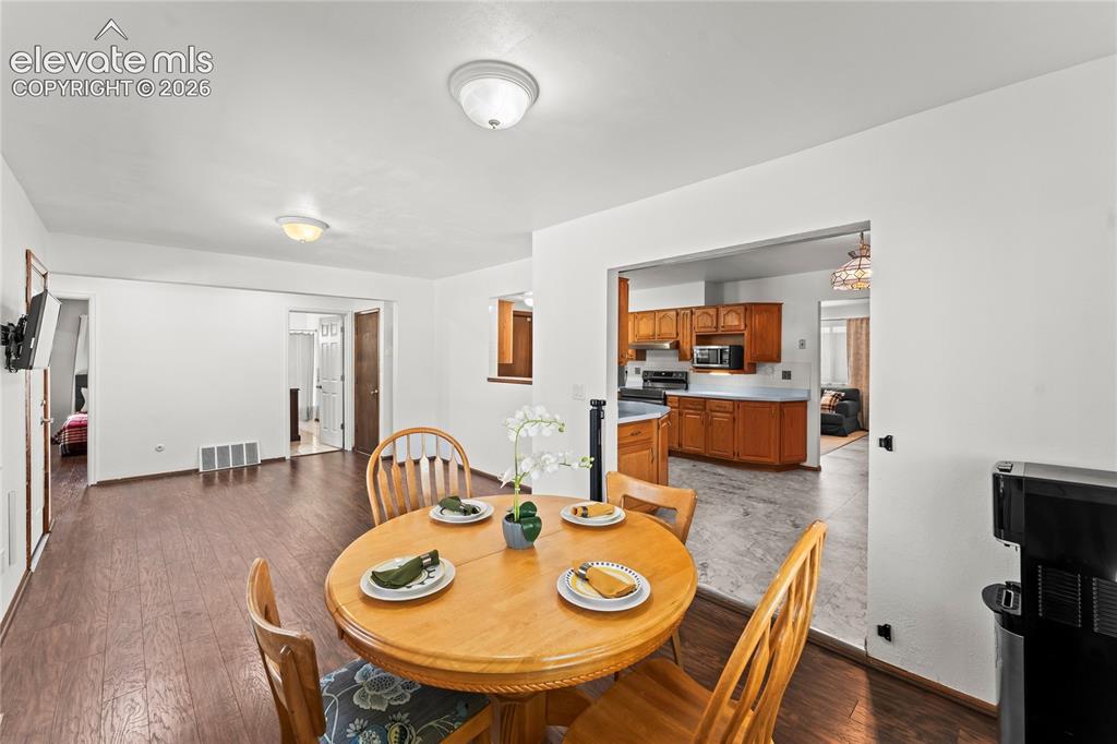 Image 5 of 45: Living area featuring neutral carpeting, white walls, and a recessed ceilin