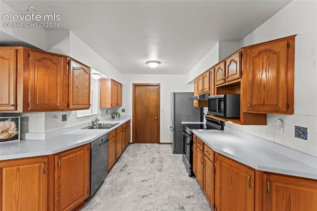 Image 6 of 45: Open kitchen leading to dinning area