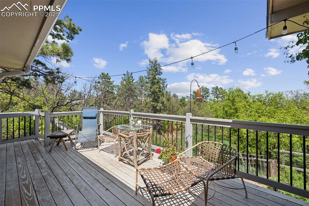 Image 13 of 33: Wooden deck featuring outdoor dining area