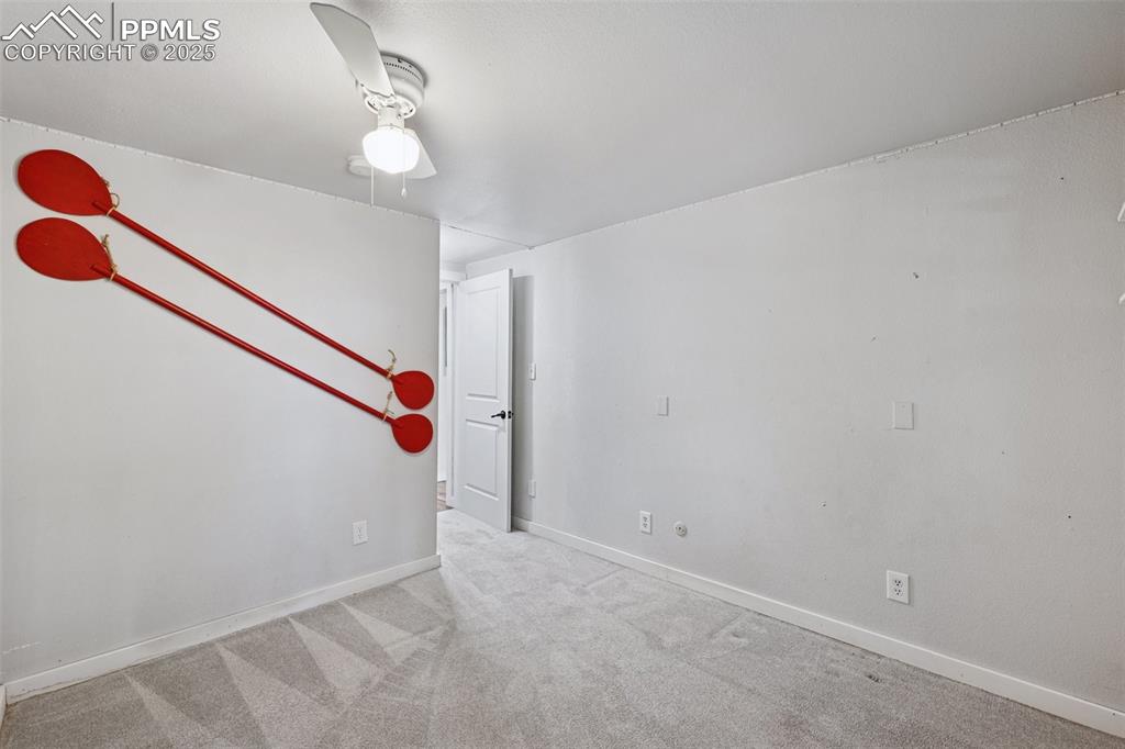 Image 28 of 33: Carpeted empty room featuring baseboards