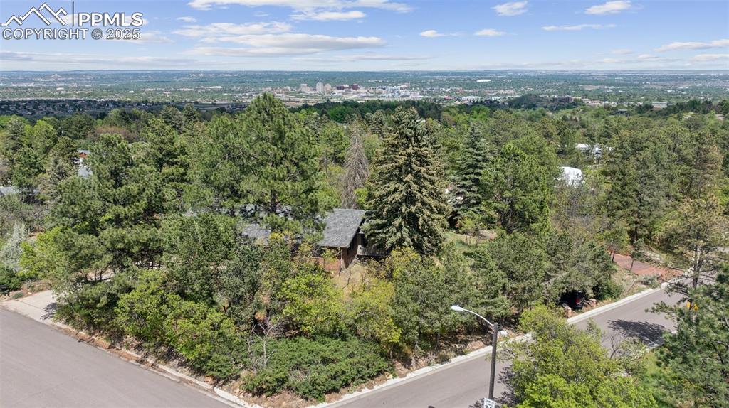 Image 4 of 33: Aerial view of a heavily wooded area