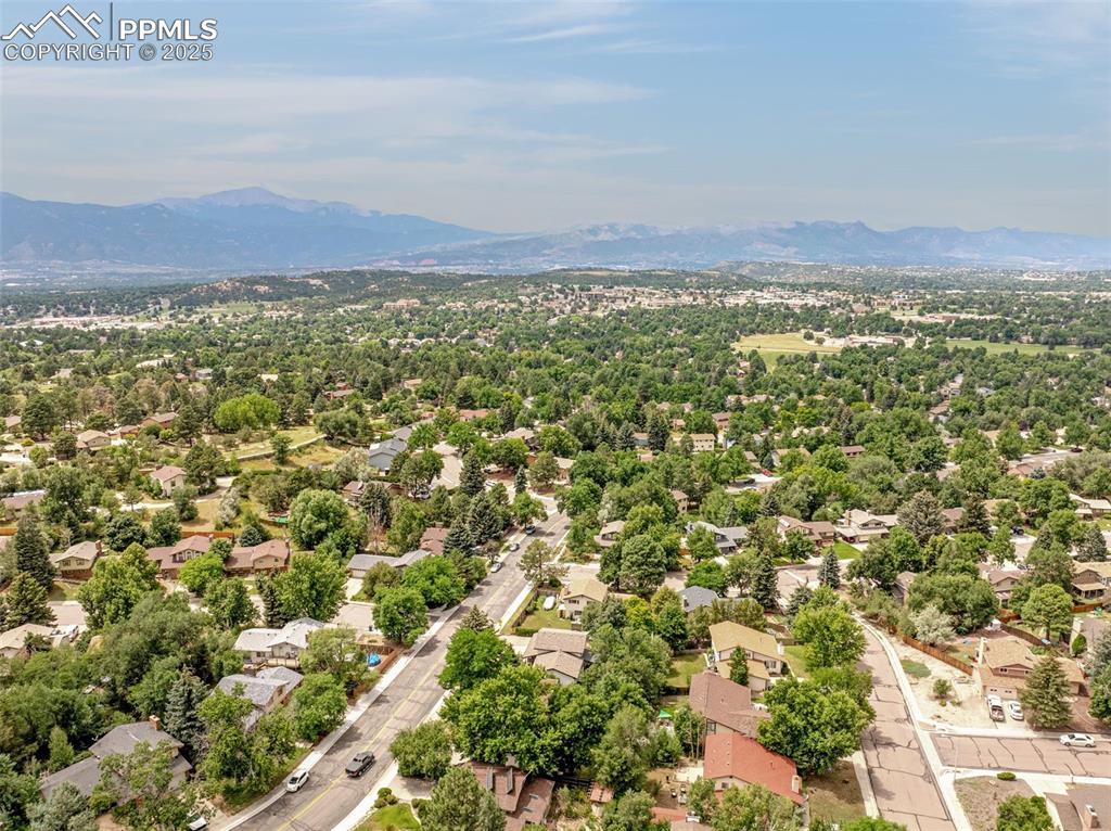 Image 31 of 33: Aerial view of residential area featuring mountains