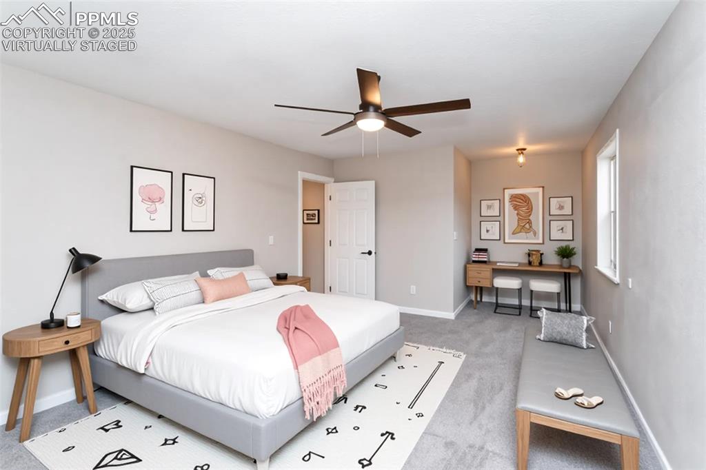 Image 29 of 50: Virtually Staged master bedroom is a great size-even fits a king-sized bed 