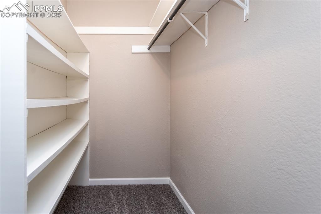 Image 31 of 50: Huge walk-in closet adjoining the main bedroom.