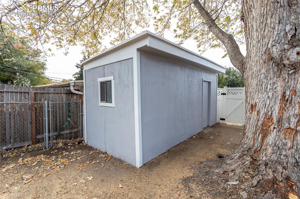 Image 46 of 50: Well-built storage shed in back yard.