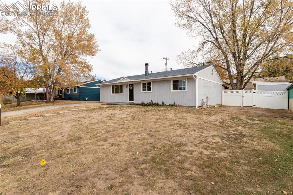 Image 48 of 50: The large front yard has room to put a carport and second driveway, or wide