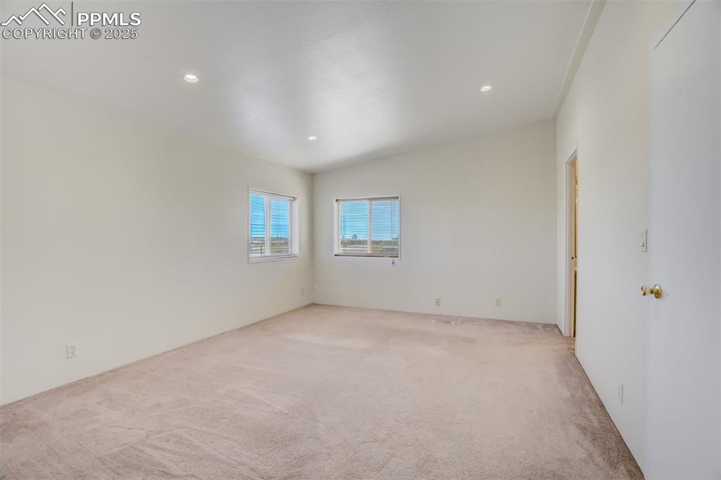 Image 23 of 50: Unfurnished room featuring recessed lighting and light colored carpet