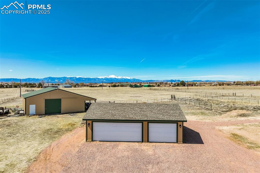 Image 36 of 50: View of pole building featuring a rural view and a mountain view