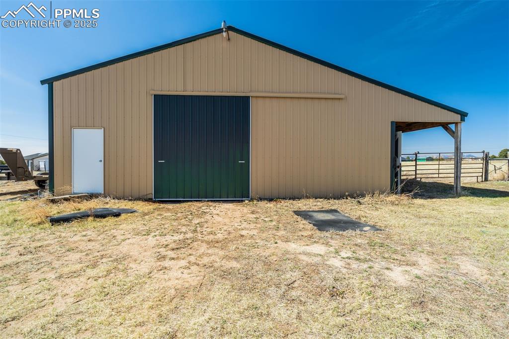 Image 43 of 50: View of pole building with fence