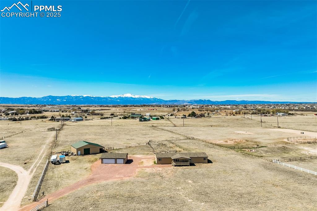 Image 47 of 50: Birds eye view of property with a rural view and a mountain view
