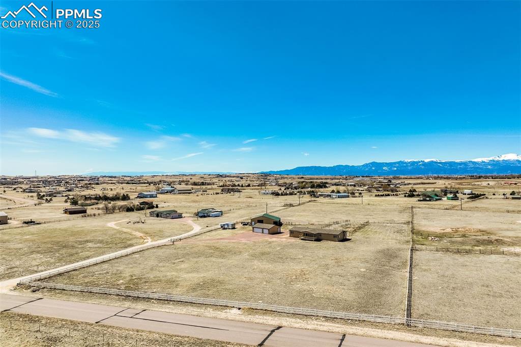 Image 48 of 50: Birds eye view of property with a rural view and a mountain view