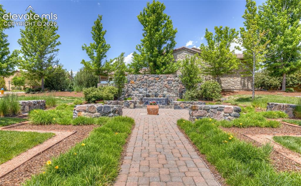 Image 46 of 50: Entry water feature and open space