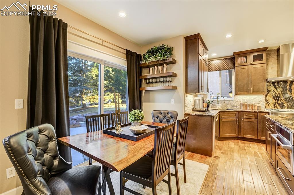 Image 12 of 50: The kitchen leads directly to the backyard; easy for grilling and entertain