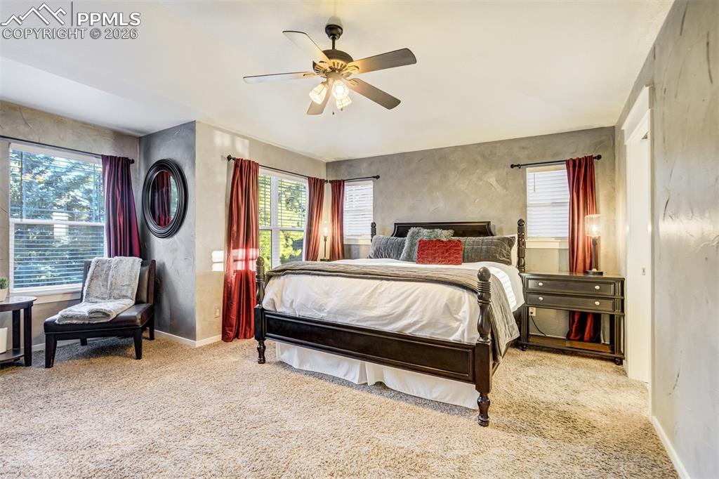 Image 21 of 50: A perfect primary retreat complete with a sitting area