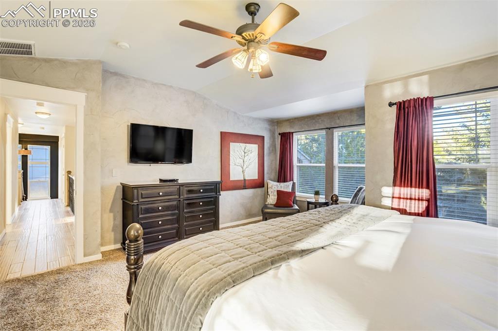 Image 22 of 50: The primary suite is located down the hall from the additional 3 upper leve