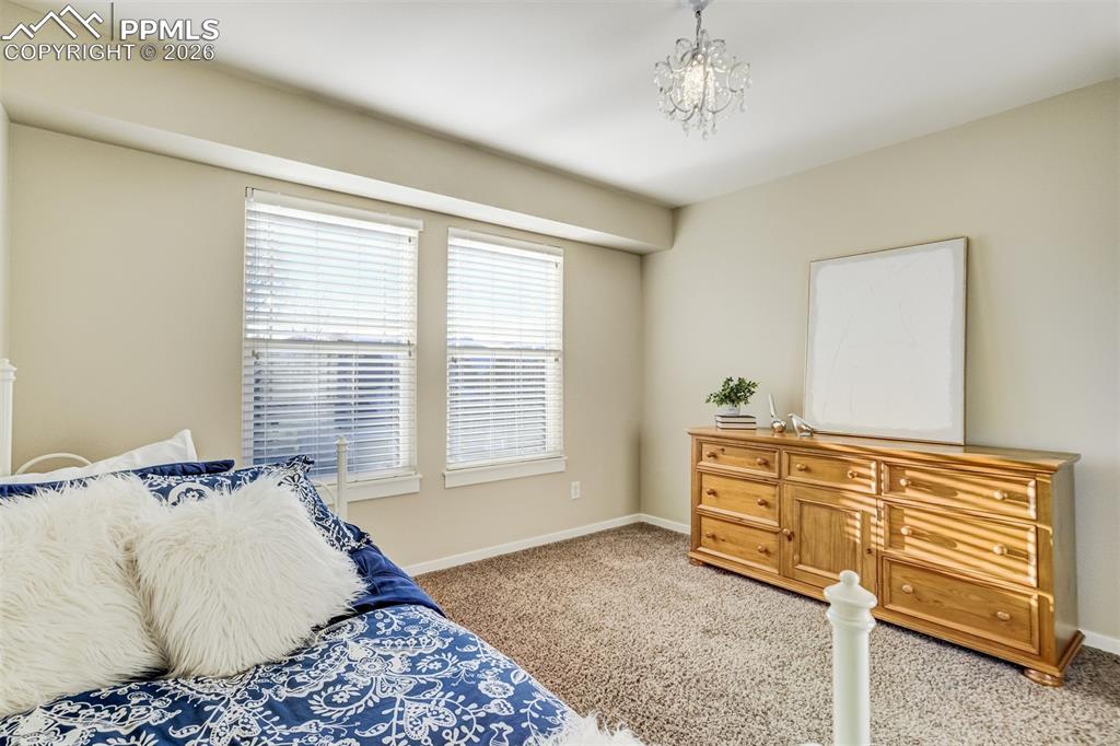 Image 28 of 50: A third bedroom bedroom on upper level