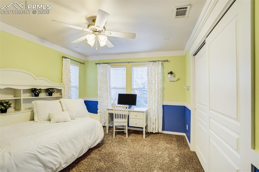 Image 30 of 50: A fourth bedroom on the upper level