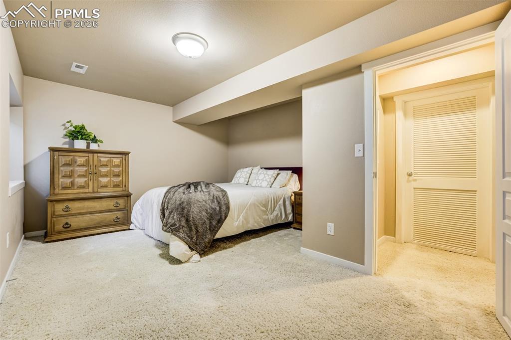 Image 38 of 50: A 5th spacious bedroom in basement is ideal for multi-generational living