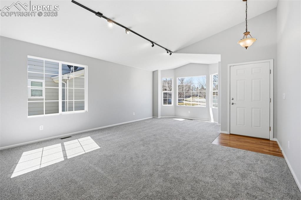 Image 11 of 36: Upper deck area over looking backyard and near trail system