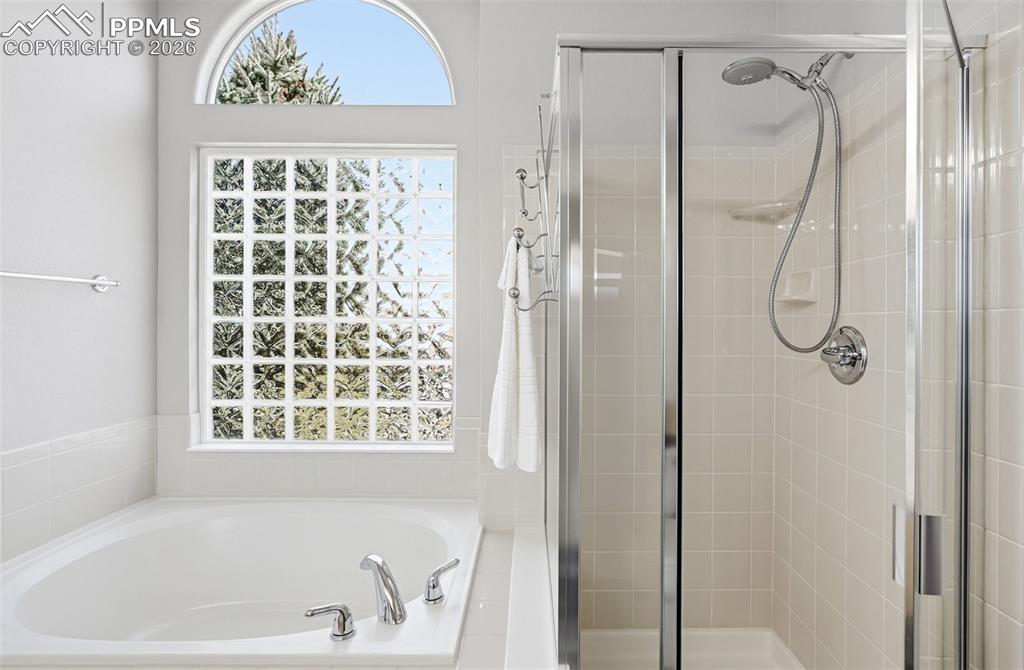 Image 16 of 36: 5 piece primary bath with dual vanities