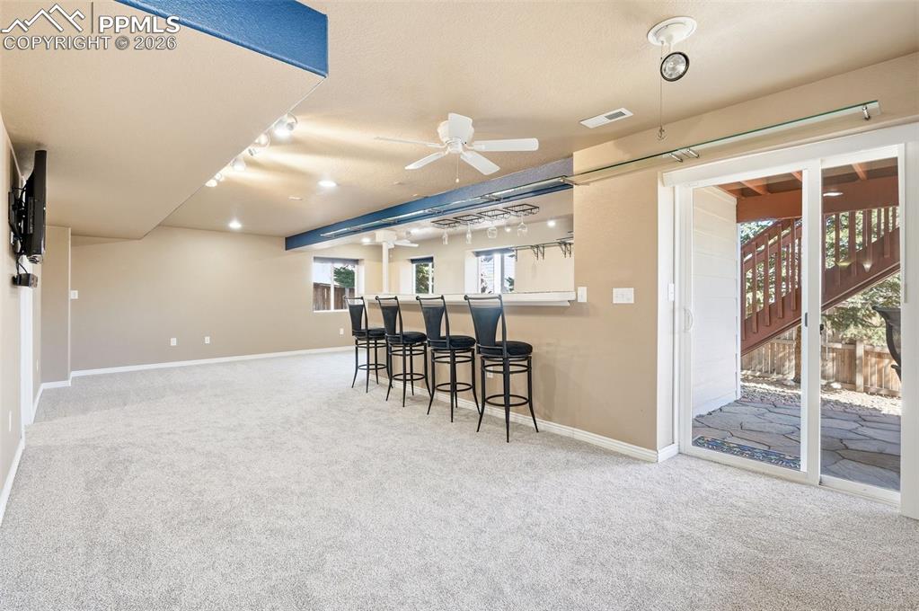 Image 23 of 36: Basement media room and high def TV, sound equipment and theater chairs sta