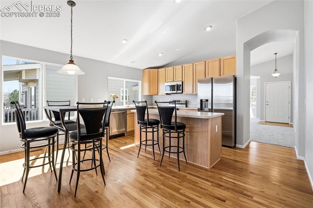Image 6 of 36: Main floor family room open to kitchen and breakfast area