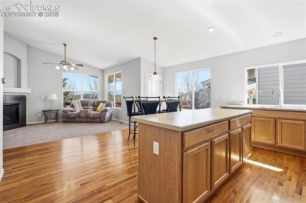Image 7 of 36: Breakfast area and island with bar seating