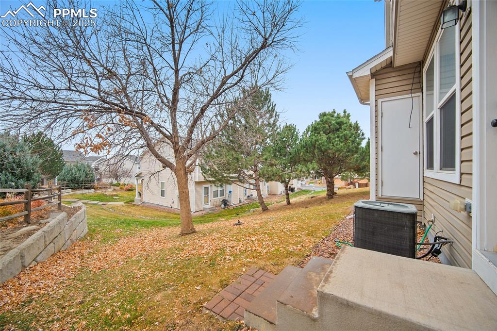 Image 31 of 33: Grassy area off the back door. 