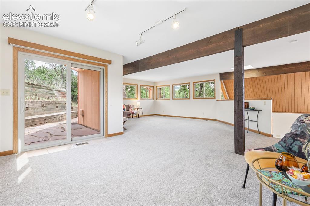 Image 10 of 41: The spacious dining room accesses the roomy flagstone patio.  