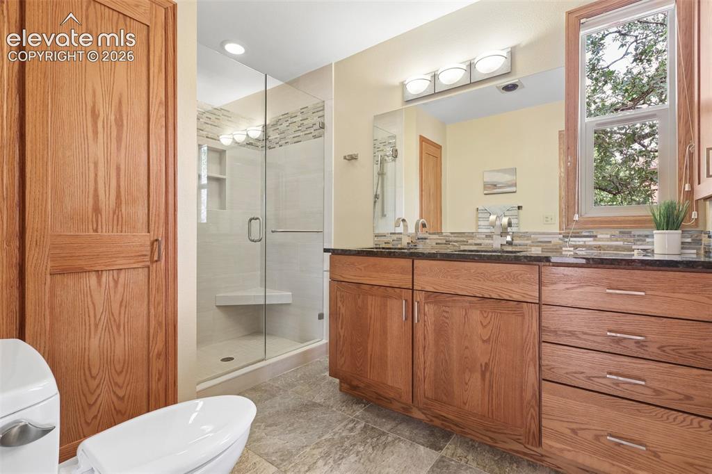 Image 20 of 41: Enjoy the linen storage and spacious shower!
