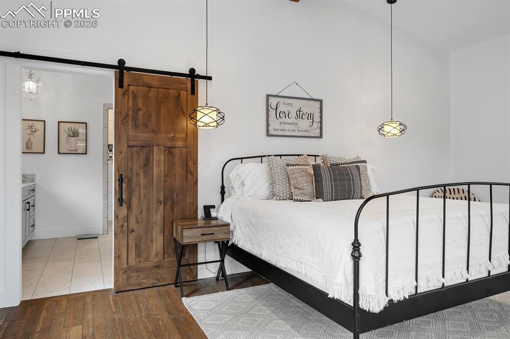 Image 14 of 30: Custom alder wood barn doors throughout