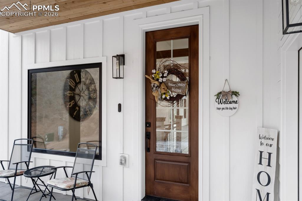 Image 4 of 30: Gorgeous rustic-modern design inside and out! Covered front porch.