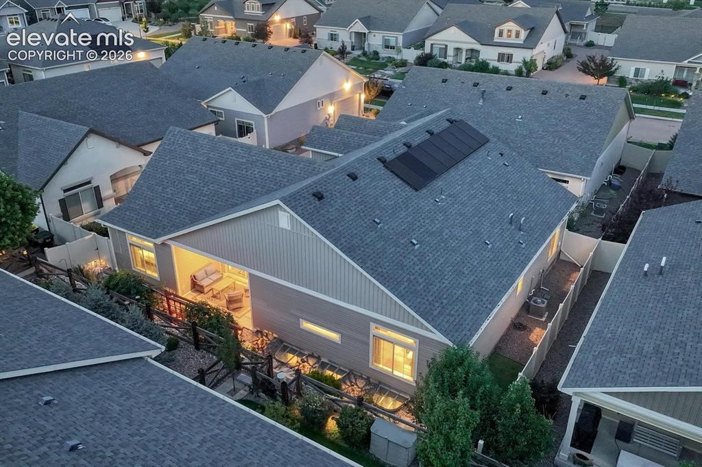 Image 36 of 44: Asphalt shingle roofing with installed solar panels