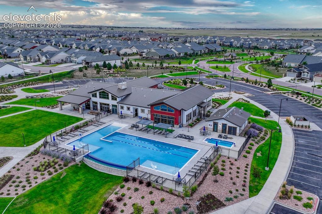 Image 39 of 44: Expansive community recreation center featuring a large swimming pool, sepa