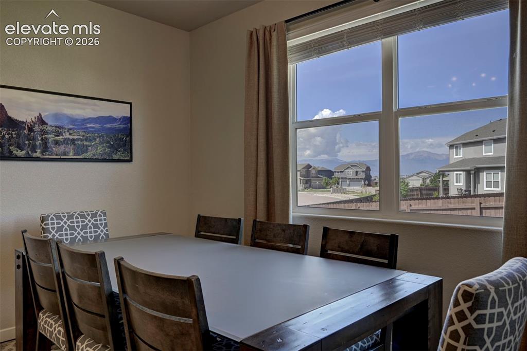 Image 20 of 40: Window with white frame and horizontal blinds
