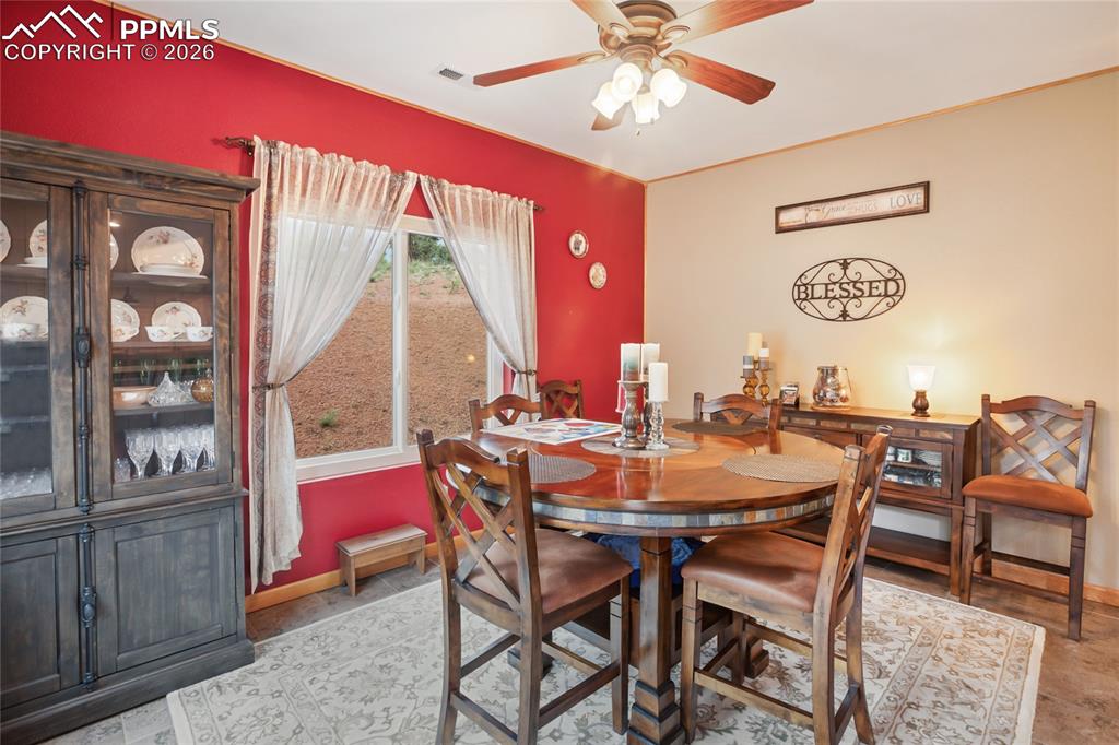 Image 10 of 33: The dining area with pine crown molding and matching baseboards!