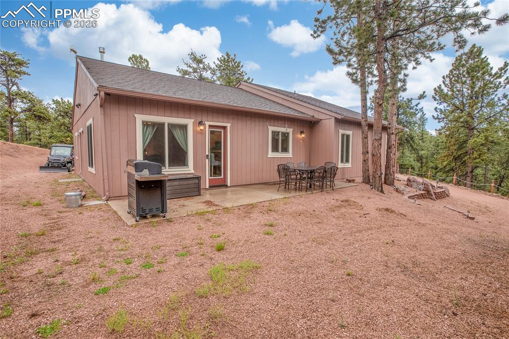 Image 19 of 33: The back of the property has a patio that has plenty of room to enjoy the o