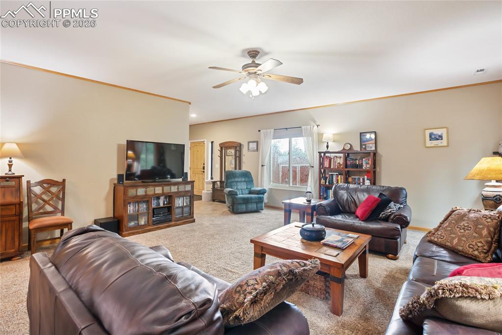 Image 5 of 33: The large living room overlooking the entry way!