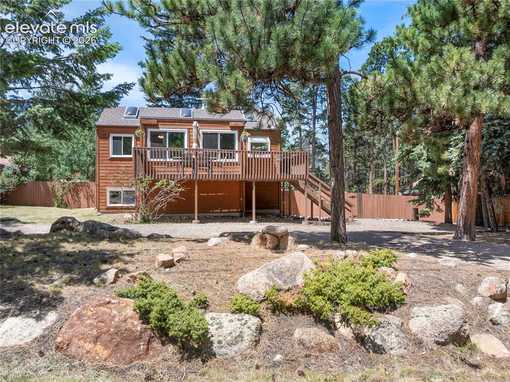 Image 2 of 27: Sitting on a rustic, treed lot but still minutes from parks, trails and sto