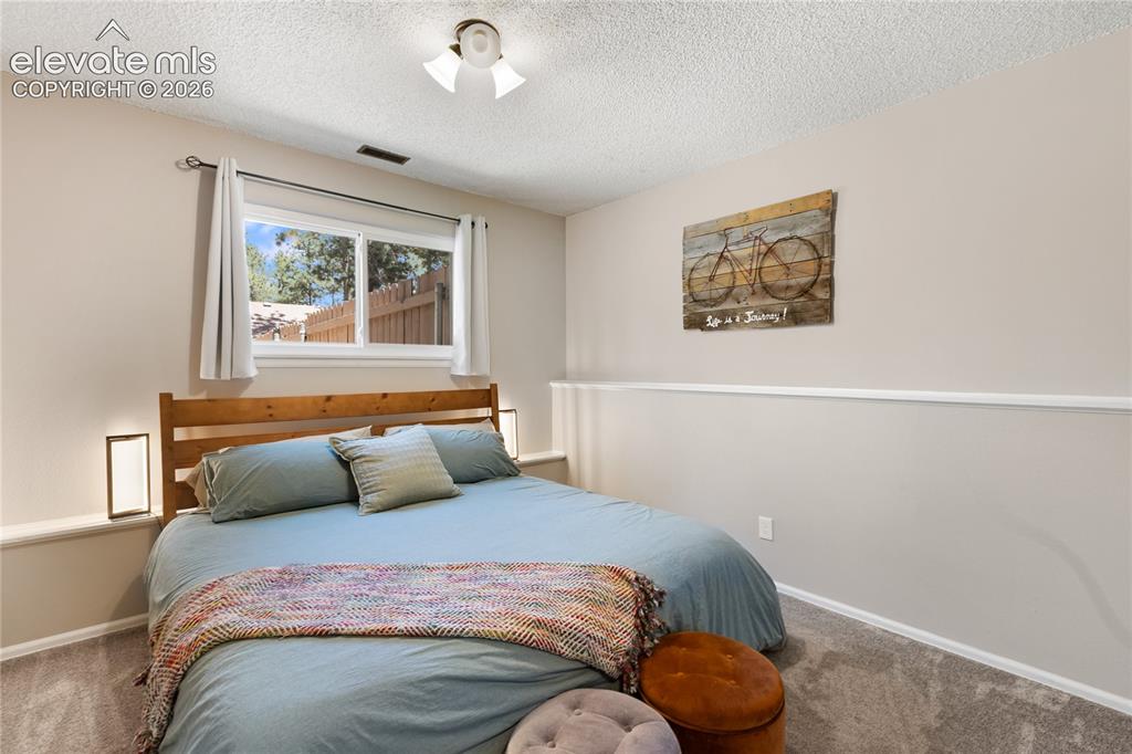 Image 23 of 27: Second lower level bedroom