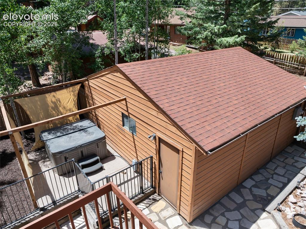 Image 9 of 27: And for those cool Colorado evenings, your very own hot tub, tucked between