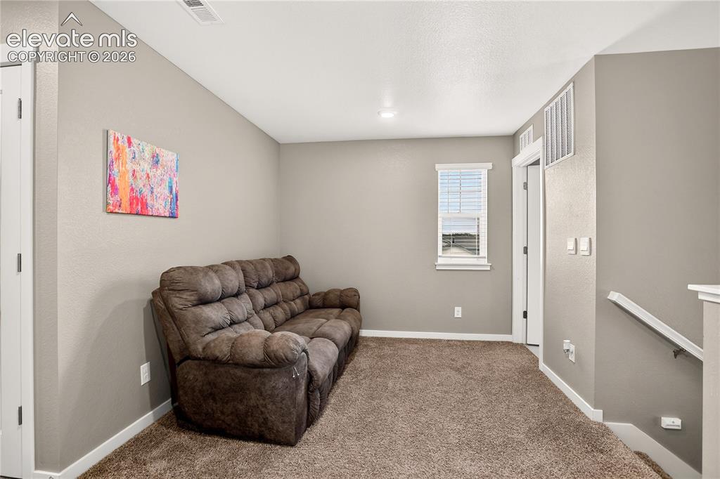 Image 11 of 20: Upstairs loft space